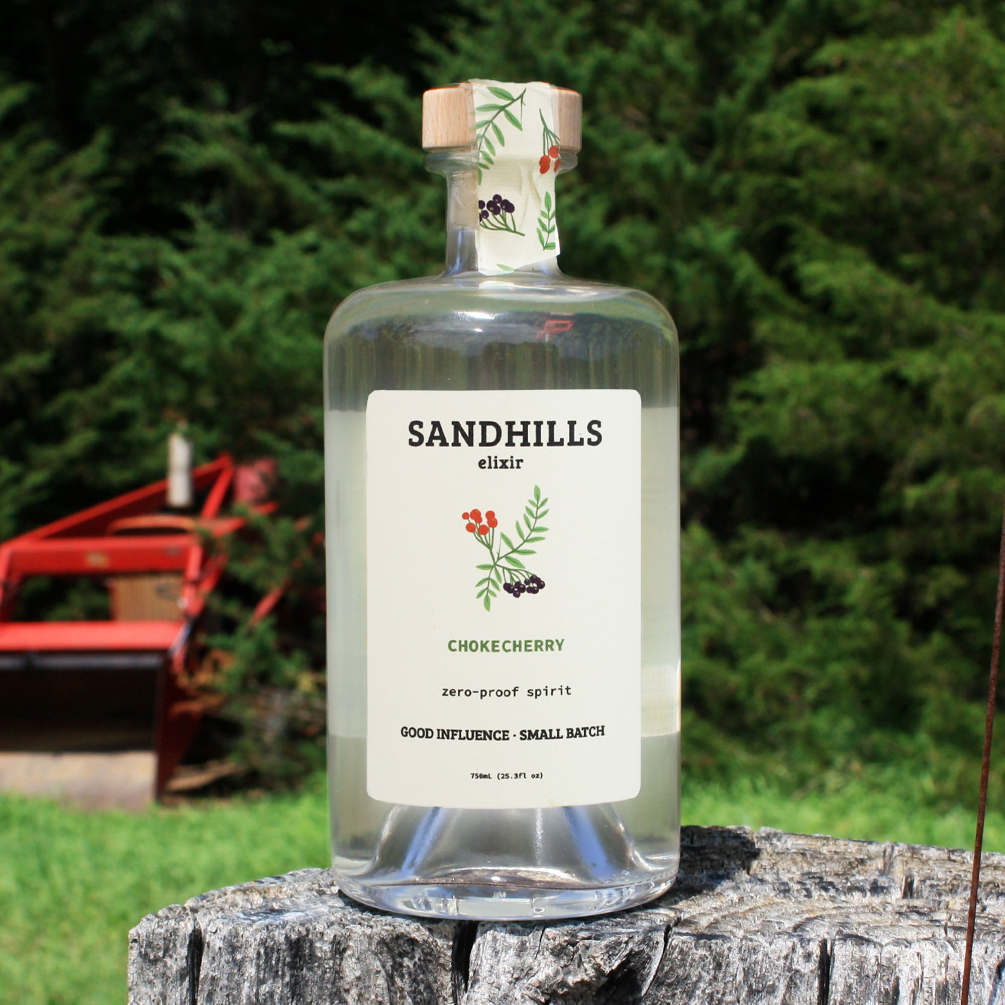 Chokecherry zero-proof spirit bottle in a Nebraska prairie setting