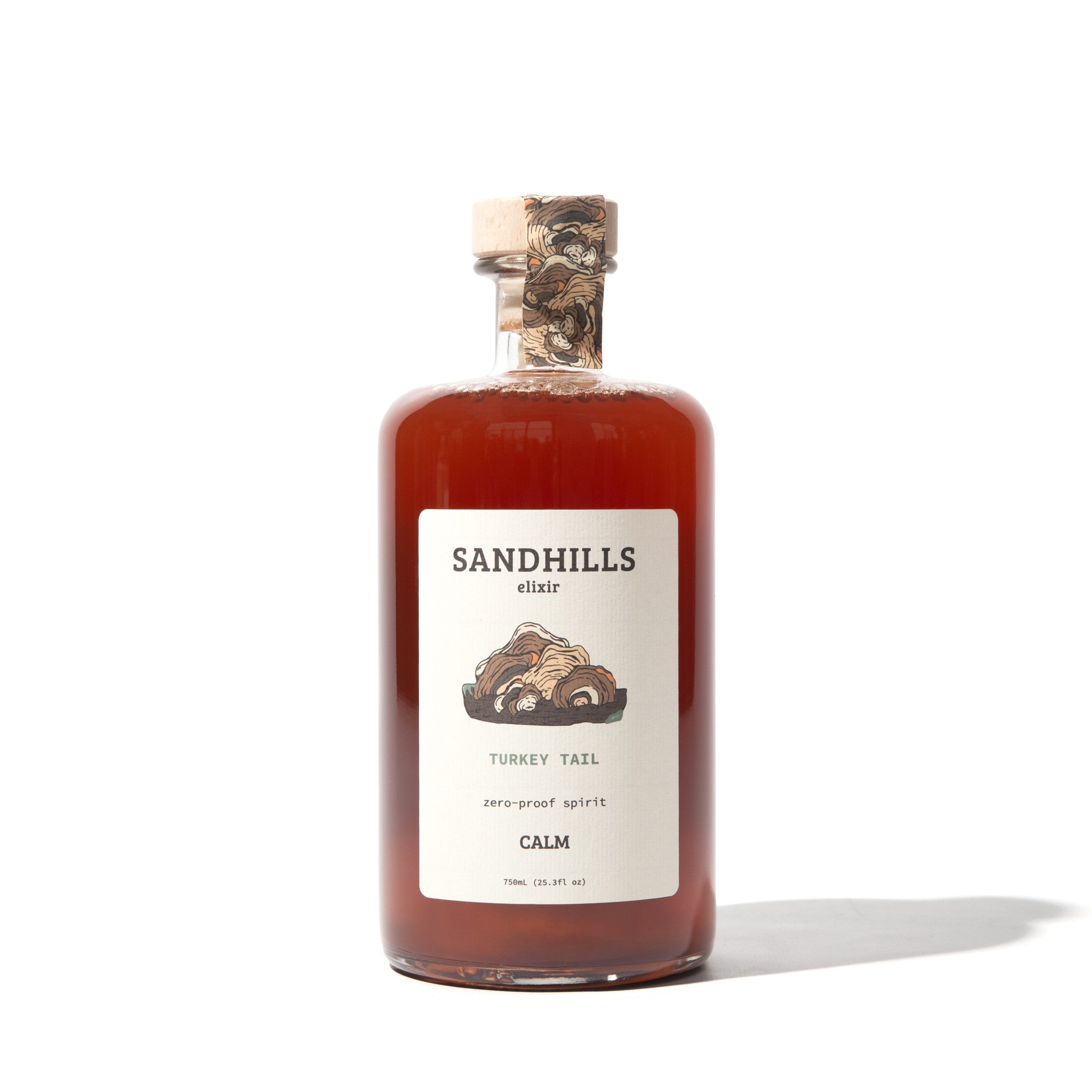 Turkey tail mushroom adaptogen drink in an amber bottle with cork stopper